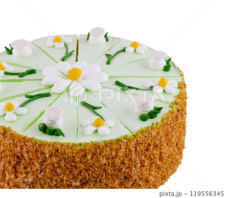 Delicious biscuit cake decorated with green butter cream and daisies Delicious biscuit cake decorated with green butter cream and daisies 119556345