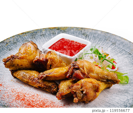 Delicious fried chicken wings being served with salad and tomato sauce Delicious fried chicken wings being served with salad and tomato sauce 119556677