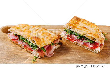 Fresh italian panini sandwich on wooden board 119556789