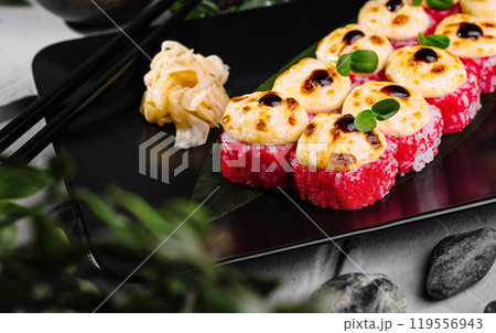 Delectable torched sushi platter on black slate Delectable torched sushi platter on black slate 119556943