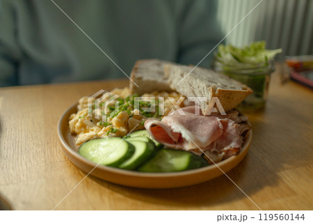 Delicious sandwiches with eggs, ham and cucumbers served on buffet table for brunch Delicious sandwiches with eggs, ham and cucumbers served on buffet table for brunch 119560144