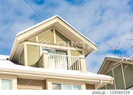 Top of residential house on blue sky background on winter season in Canada 119560159