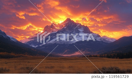 A majestic mountain range silhouetted against a breathtaking sunset sky, creating a dramatic and inspiring landscape 119561729