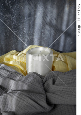 Homemade white ceramic candles on grey background Homemade white ceramic candles on grey background 119561785