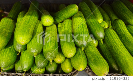 Cucumbers background. Cucumbers on store shelves. Vegetables in the store 119564325