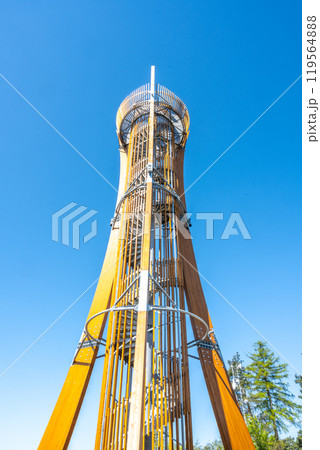 The Hamstejn lookout tower features a steel structure with a spiral staircase, offering stunning views of the Bohemian Paradise landscape on a clear day. Visitors can climb and enjoy the scenery. The Hamstejn lookout tower features a steel structure with a spiral staircase, offering stunning views of the Bohemian Paradise landscape on a clear day. Visitors can climb and enjoy the scenery. 119564888