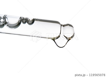 Dropper pipette with delicious serum with bubbles close-up. Dropper pipette with delicious serum with bubbles close-up. 119565078