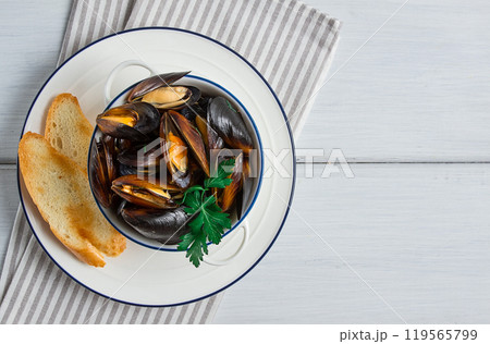 Fresh, Boiled mussels, Black Sea, with white bread, on a white wooden table, no people, 119565799