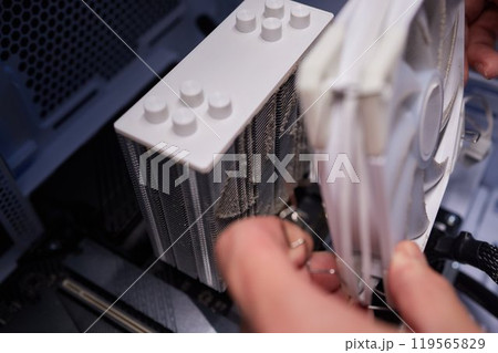 Cleaning a processor fan with a brush 119565829