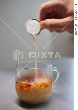 Cup of hot cappuccino coffee on table 119565901