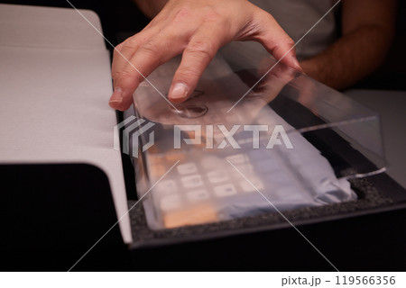 Unboxing a Remarkably Stylish and Innovative Tech Device That Features an Eye Catching Design 119566356