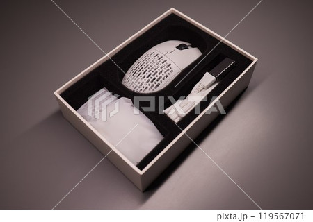 white new wireless computer mouse flat lay with led lights 119567071