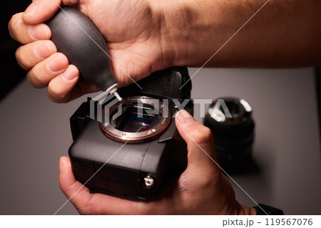 Cleaning the camera sensor with a blower for office equipment and electronics from contamination. Cleaning and care of the camera sensor Cleaning the camera sensor with a blower for office equipment and electronics from contamination. Cleaning and care of the camera sensor 119567076