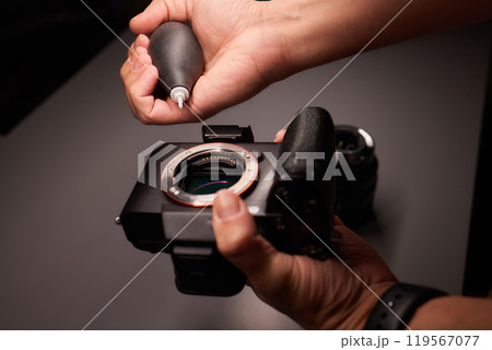 Cleaning the camera sensor with a blower for office equipment and electronics from contamination. Cleaning and care of the camera sensor Cleaning the camera sensor with a blower for office equipment and electronics from contamination. Cleaning and care of the camera sensor 119567077