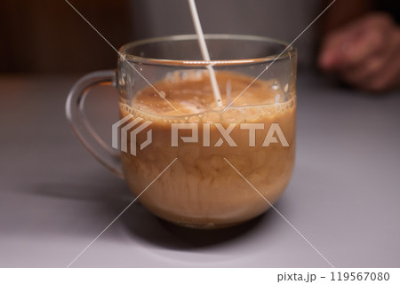 Cup of hot cappuccino coffee on table 119567080
