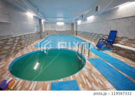 Indoor swimming pool with water chair for leisure and recreation 119567332