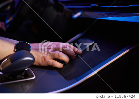 Selector automatic transmission with leather in the interior of a modern expensive car. The background is blurred. Black and brown leather car. 119567424