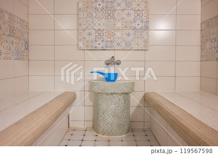 Azure and white textile floor with bench in brick building Azure and white textile floor with bench in brick building 119567598