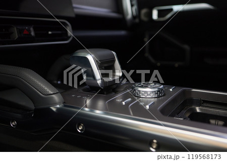 a close up of a car dashboard with a remote control a close up of a car dashboard with a remote control 119568173