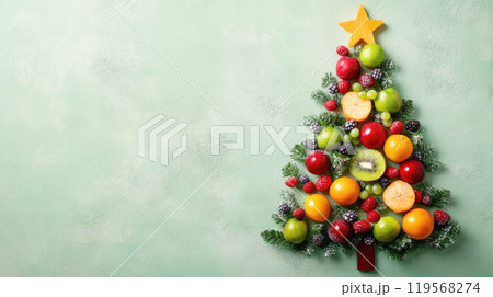 Christmas tree made of broccoli, cherry tomatoes and greens on light green background 119568274