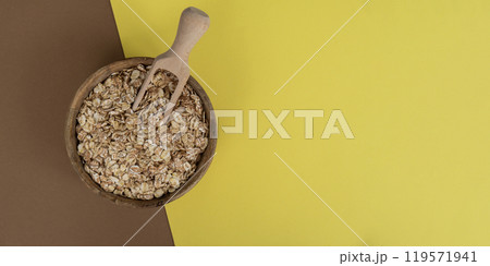 Raw oatmeal porridge copy space. Whole spelt grain species. High protein fiber-rich vegan plant based food ingredient. Gluten free superfood healthy nutritional dietary alternative Raw oatmeal porridge copy space. Whole spelt grain species. High protein fiber-rich vegan plant based food ingredient. Gluten free superfood healthy nutritional dietary alternative 119571941