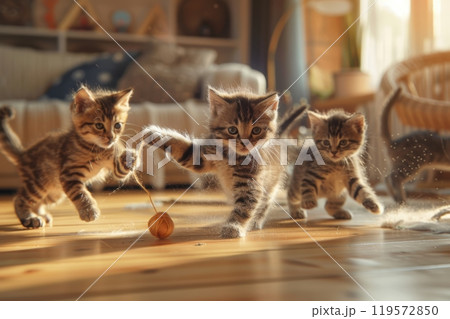Playful Kittens Chasing Yarn: Perfect for Pet Product Promotion and Cozy Home Decor 119572850