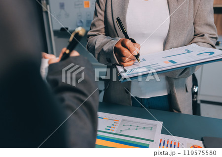 Team of business people are meeting to analyze data for marketing plan,Market research reports and income statistics, Financial and Accounting concept. 119575580