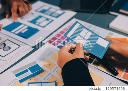The designer team is designing the uxui system to make the uxui system work well on new phones and support system updates. Website development concept UI UX front end designer The designer team is designing the uxui system to make the uxui system work well on new phones and support system updates. Website development concept UI UX front end designer 119575606