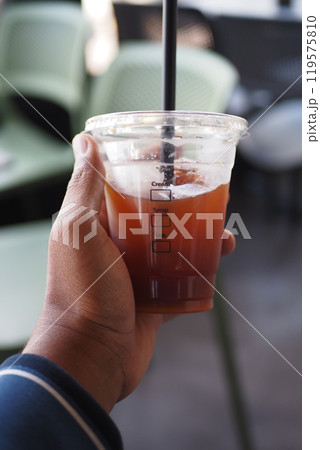 Refreshing Iced Beverage Served in a Clear Cup for Ultimate Enjoyment and Relaxation Refreshing Iced Beverage Served in a Clear Cup for Ultimate Enjoyment and Relaxation 119575810