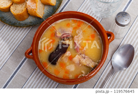 Nice plate of hot pea soup with smoked meat ready to eat 119576645