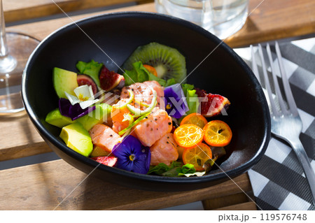 Salmon ceviche with avocado, kumquat, figs, kiwi fruit 119576748