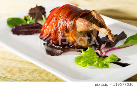 Wrapped in bacon baked quail 119577036