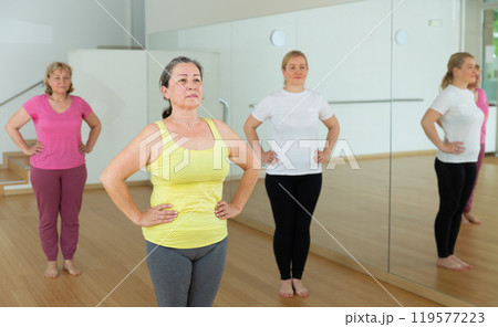 Group of mature people practicing dance techniques Group of mature people practicing dance techniques 119577223