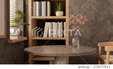 A contemporary loft room featuring a stone table and a wooden armchair by the window. 119577633