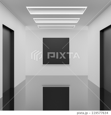 An empty picture frame for an exhibit is mounted on a white wall in a hallway corridor. 119577634