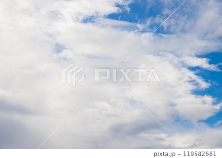 a huge fluffy white cloud in the blue sky 119582681