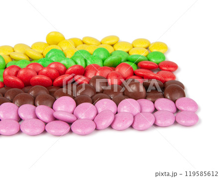 Multicolor dragee drops chocolate glazed isolated on the white background Multicolor dragee drops chocolate glazed isolated on the white background 119585612