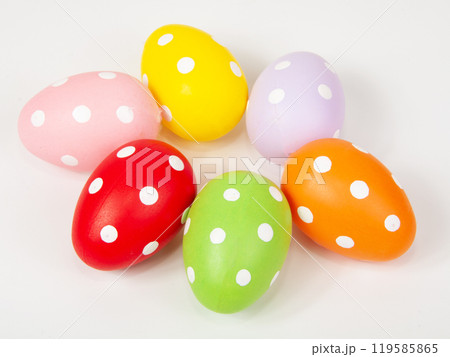 Multicolored easter eggs in dots on the white background Multicolored easter eggs in dots on the white background 119585865