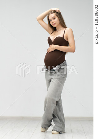 female mother happy girl motherhood expectant maternity positive pregnancy background tummy jeans female mother happy girl motherhood expectant maternity positive pregnancy background tummy jeans 119586002