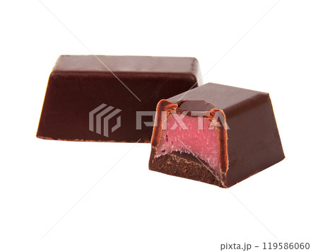 Chocolate sweets with pink strawberry filling praline isolated on the white 119586060