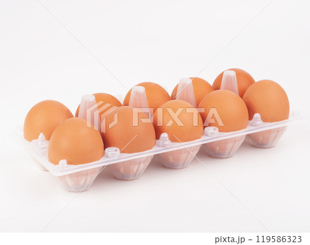 Fresh hen eggs in egg tray box on the white background 119586323