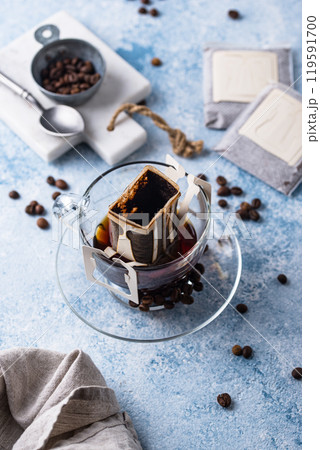 Freshly brewed drip coffee in glass cup Freshly brewed drip coffee in glass cup 119591700