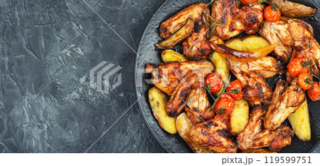 Roast chicken wings. 119599751
