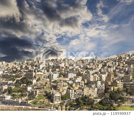 Amman city landmarks-- old roman Citadel Hill, Jordan. Against the background of a beautiful sky with clouds Amman city landmarks-- old roman Citadel Hill, Jordan. Against the background of a beautiful sky with clouds 119599937