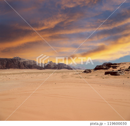 Wadi Rum Desert also known as The Valley of the Moon (against the sky with clouds)-- is a valley cut into the sandstone and granite rock in southern Jordan 60 km to the east of Aqaba 119600030