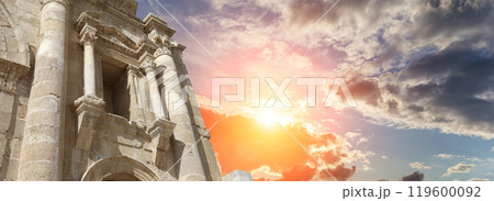 Arch of Hadrian in Gerasa (Jerash)-- was built to honor the visit of emperor Hadrian to Jerash in 129/130 AD, Jordan. Against the background of a beautiful sky with clouds Arch of Hadrian in Gerasa (Jerash)-- was built to honor the visit of emperor Hadrian to Jerash in 129/130 AD, Jordan. Against the background of a beautiful sky with clouds 119600092