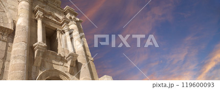 Arch of Hadrian in Gerasa (Jerash)-- was built to honor the visit of emperor Hadrian to Jerash in 129/130 AD, Jordan. Against the background of a beautiful sky with clouds Arch of Hadrian in Gerasa (Jerash)-- was built to honor the visit of emperor Hadrian to Jerash in 129/130 AD, Jordan. Against the background of a beautiful sky with clouds 119600093
