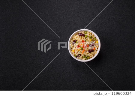 Boiled wheat bulgur porridge with vegetables peppers, peas, corn 119600324