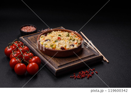 Boiled wheat bulgur porridge with vegetables peppers, peas, corn 119600342