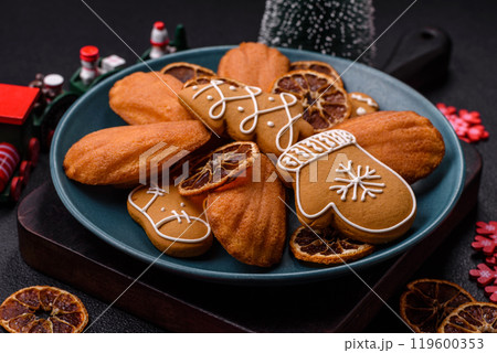 French classic madeleine sponge cake with elements of Christmas motifs French classic madeleine sponge cake with elements of Christmas motifs 119600353